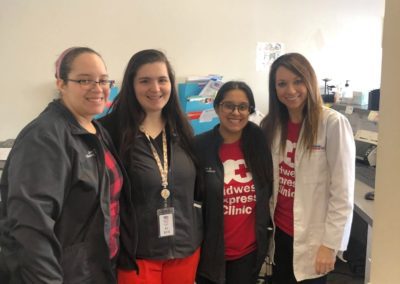 Staff at Midwest Express Clinic wears red for American Hear Month in February 2020.