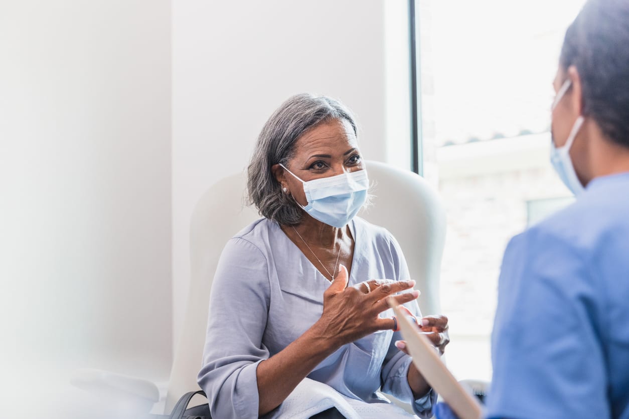 Senior adult patient talks with provider