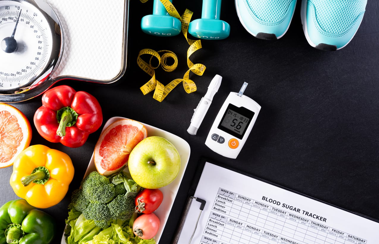 Healthy food, exercise equipment, blood glucometer, tools to help with diabetes management