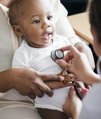 Pediatrics - Doctor examining child with a stethoscope